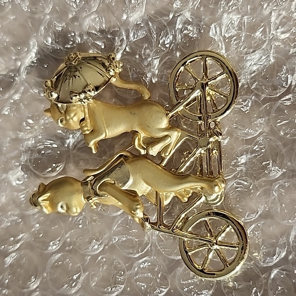1980 signed two cats on a bike brooch